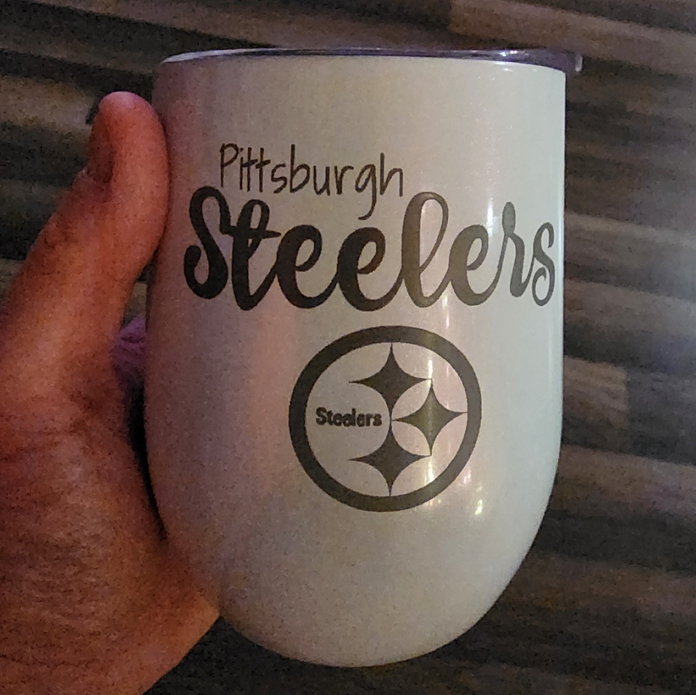 Silver Accent Mug with Circular Emblem and Text Design